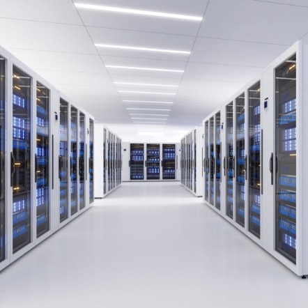 Clean data center corridor with enclosed server racks showing the controlled environment design used to support heat management and equipment reliability