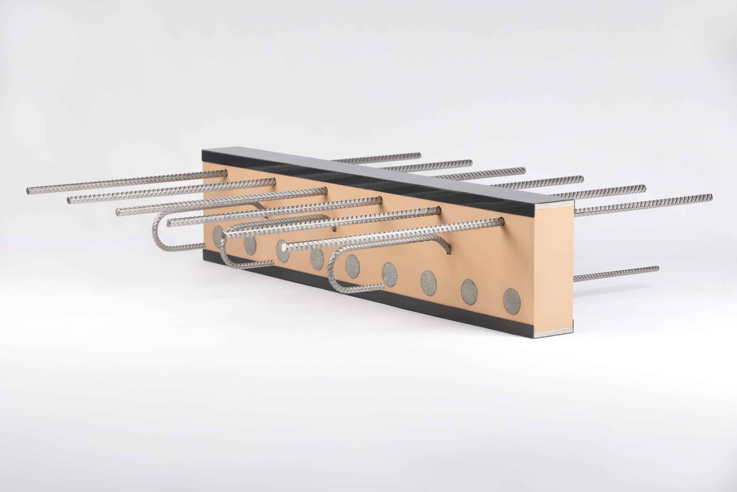 Armatherm cast in situ thermal break unit with continuous rebar passing through the insulating element to reduce thermal bridging at reinforced concrete connections in structural building design