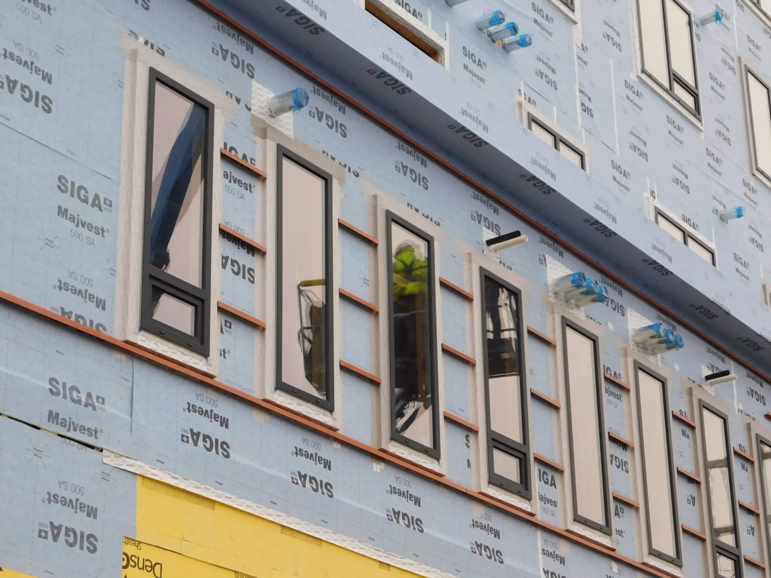 A building face during construction including structural components featuring Armatherm materials